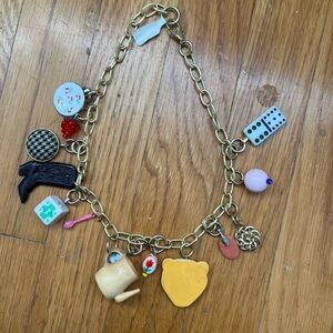 Gold and Red Necklace with Charming Accents